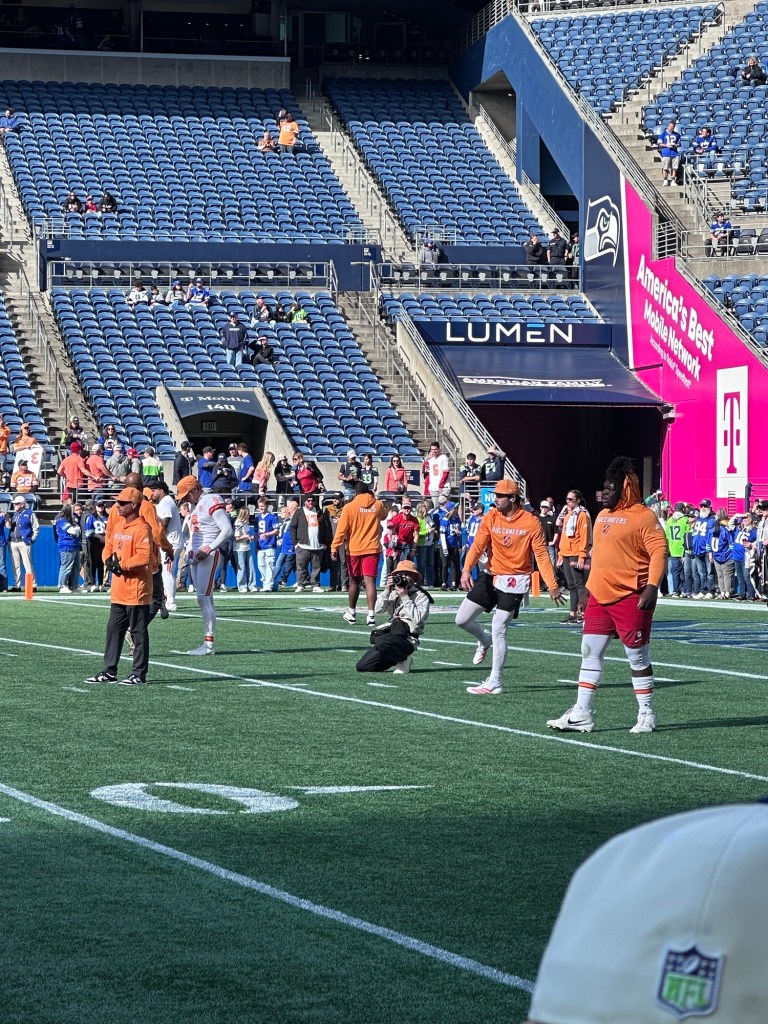 Pregame field access view of players and fans inside Lumen Field stadium